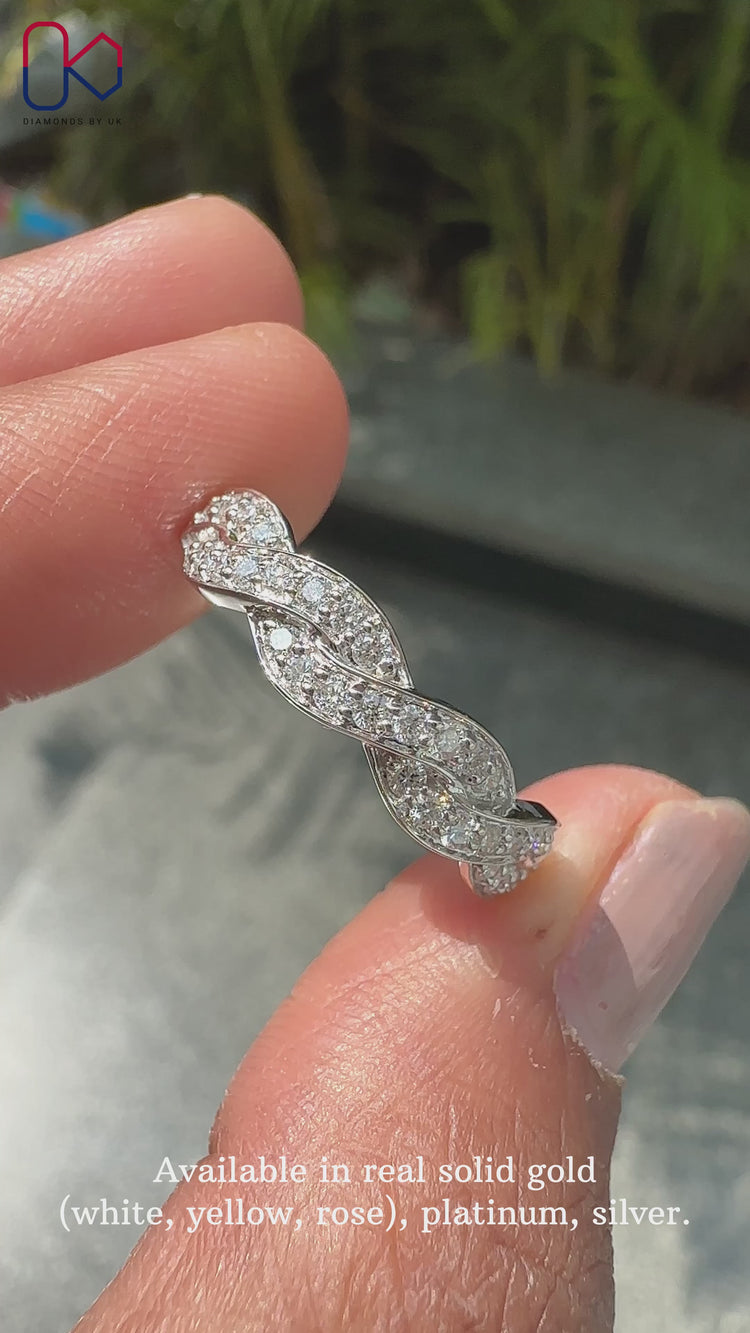 Round diamond wedding band featuring a timeless and graceful style.
