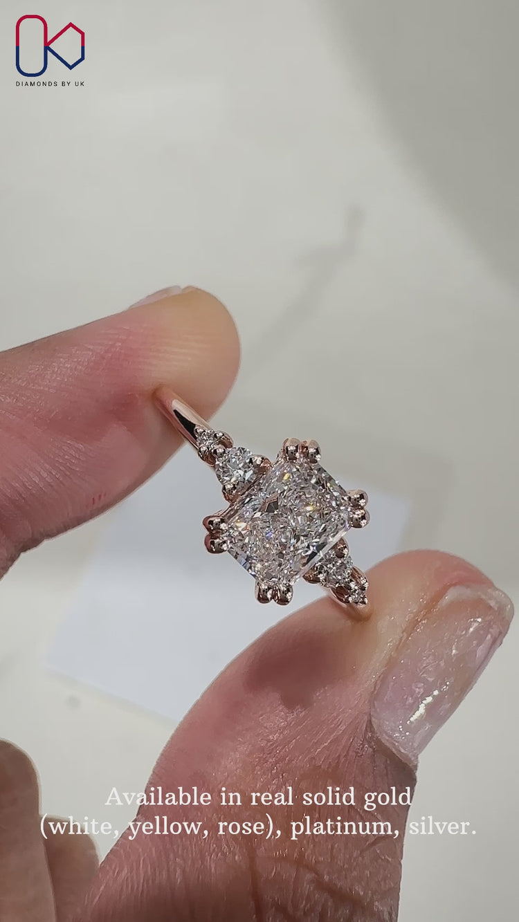 Round side stone and double prong setting.
