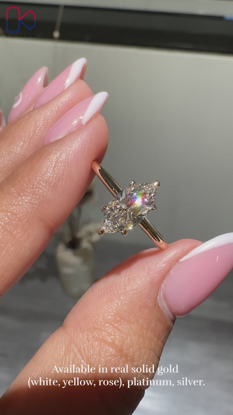 Elegant marquise ring with a hidden halo setting.
