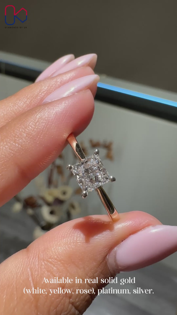 Princess cut diamond engagement ring in a 4 prong setting.
