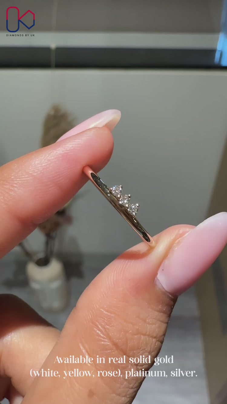 Round diamond wedding band with 3 stones.
