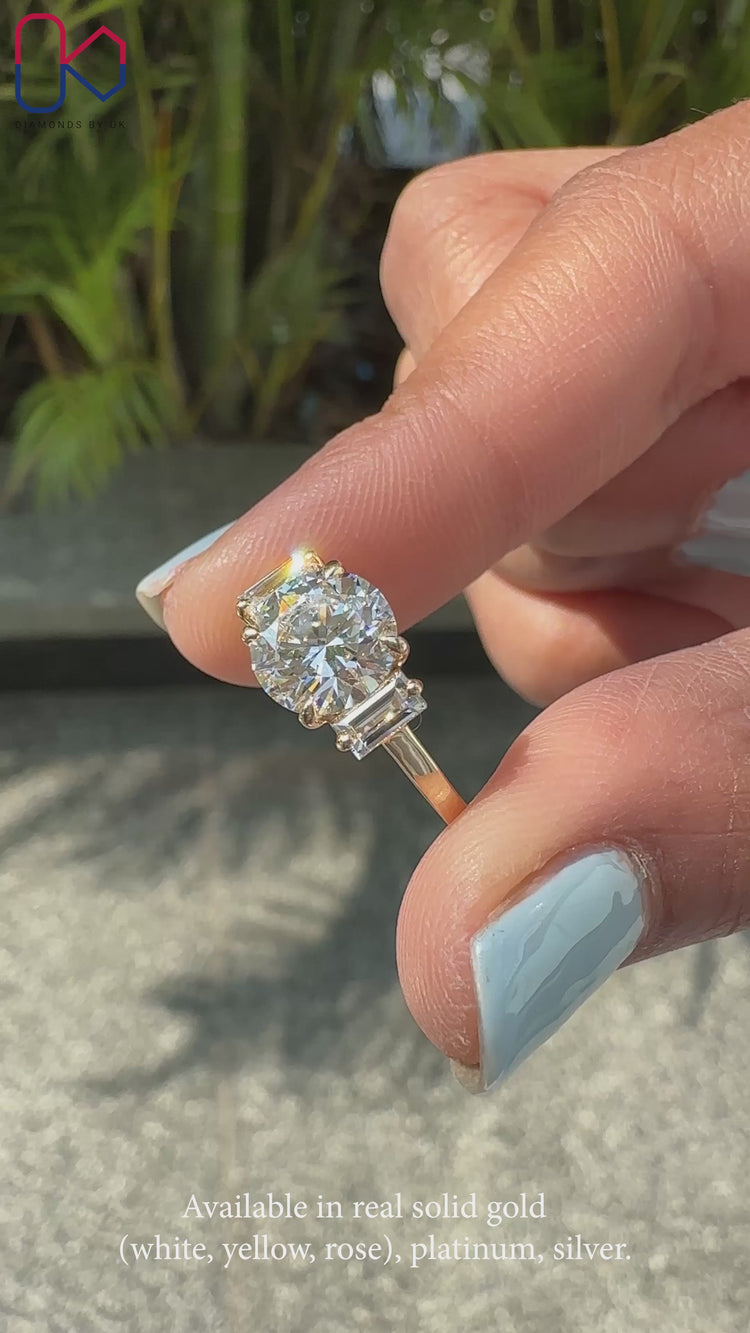 Baguette side stone with cathedral setting ring.
