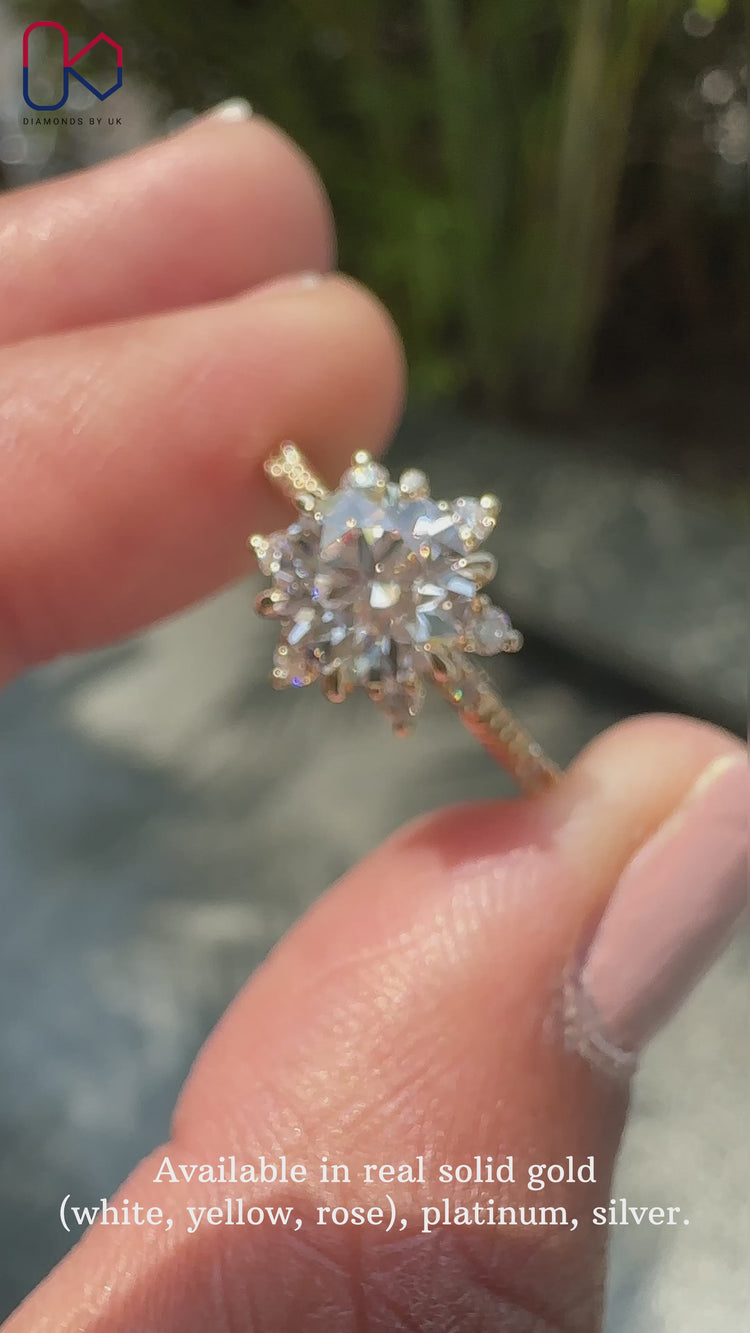Round cut diamond ring in a stunning cluster halo design.

