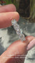Round diamond wedding band crafted with shared prong settings for added brilliance.