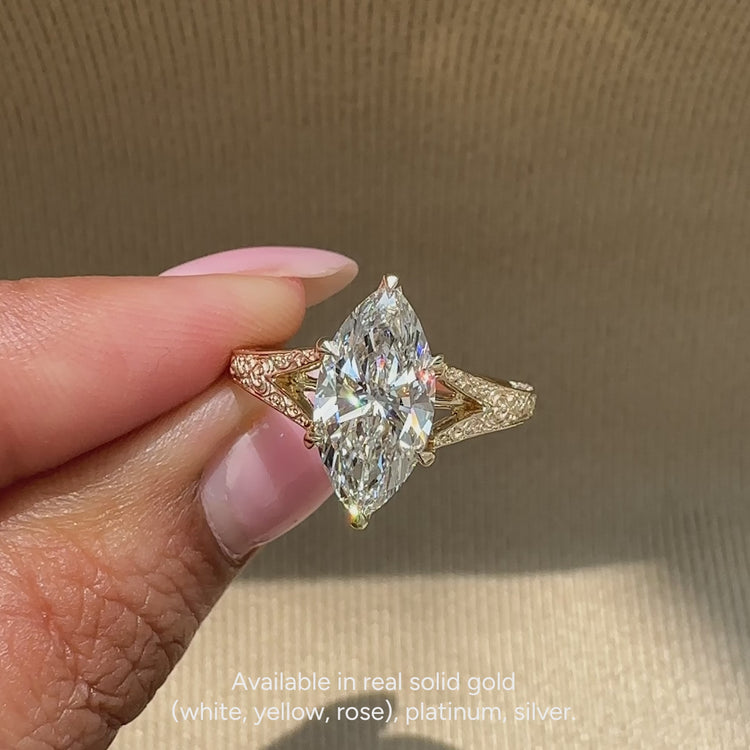 Diamondsbyuk marquise solitaire ring with vintage style.
