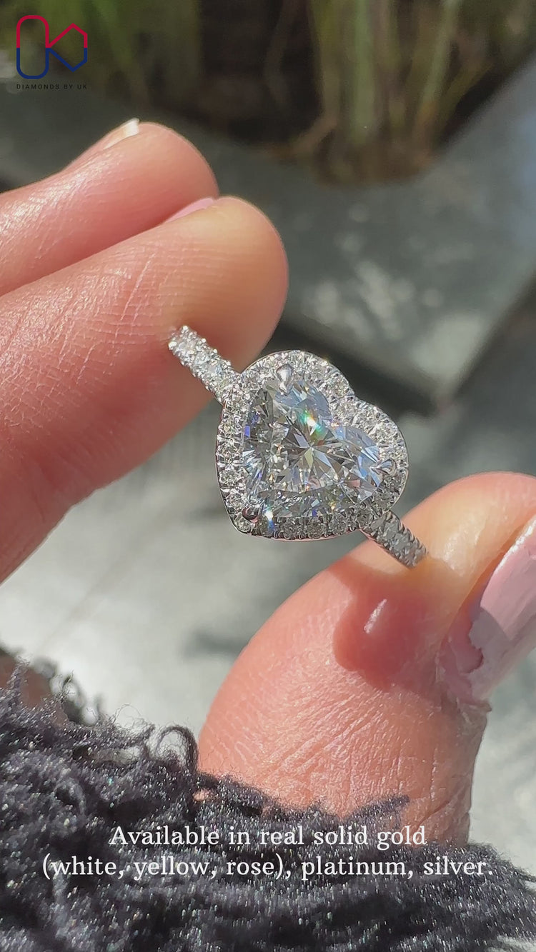 Halo engagement ring featuring a stunning heart cut diamond.