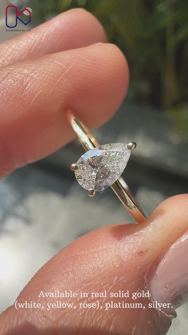 Pear cut diamond ring set in a classic solitaire ring design for timeless elegance.