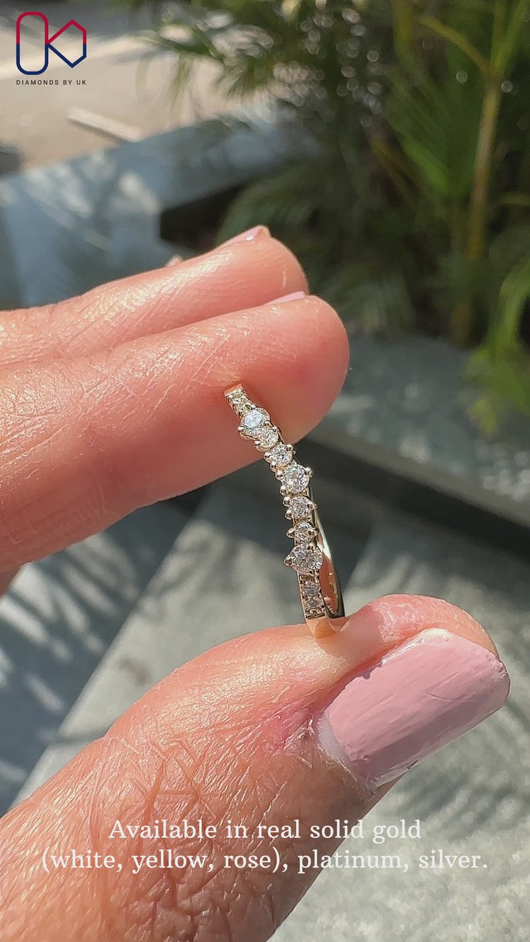 Curved wedding band yellow gold crafted with prong setting
