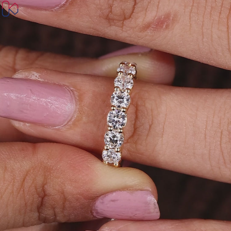 Round cut diamond band designed as a handmade jewellery piece.
