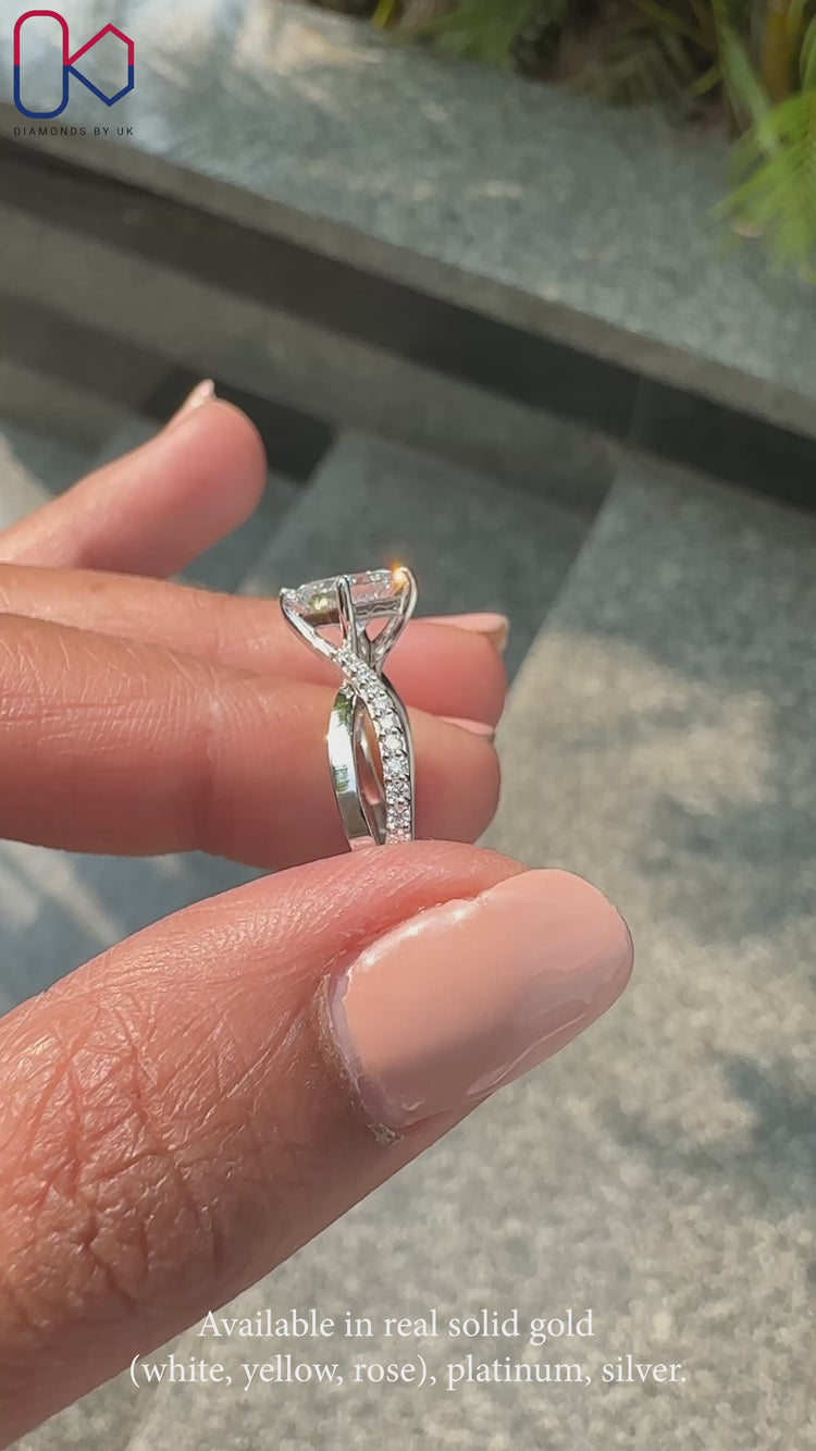 Twisted band engagement ring with sparkling pave detailing.
