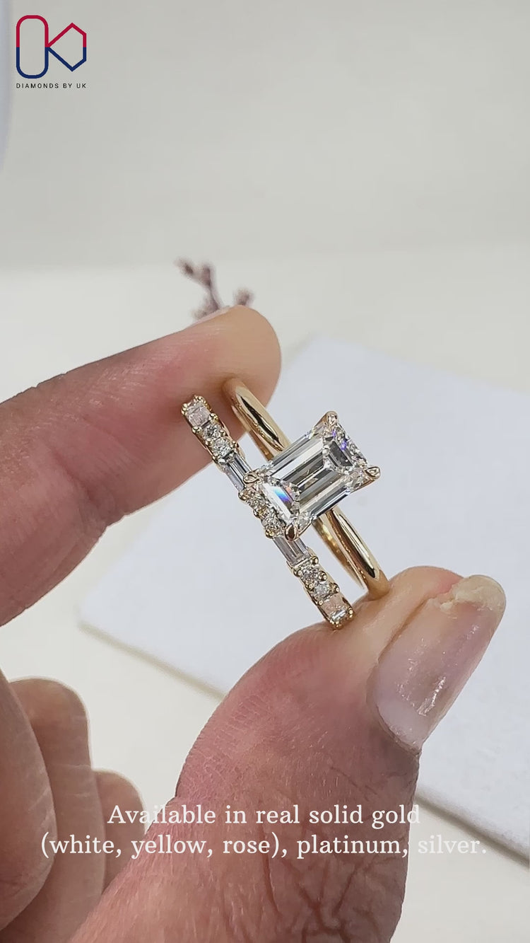 Elegant emerald cut ring featuring a sparkling centre diamond.
