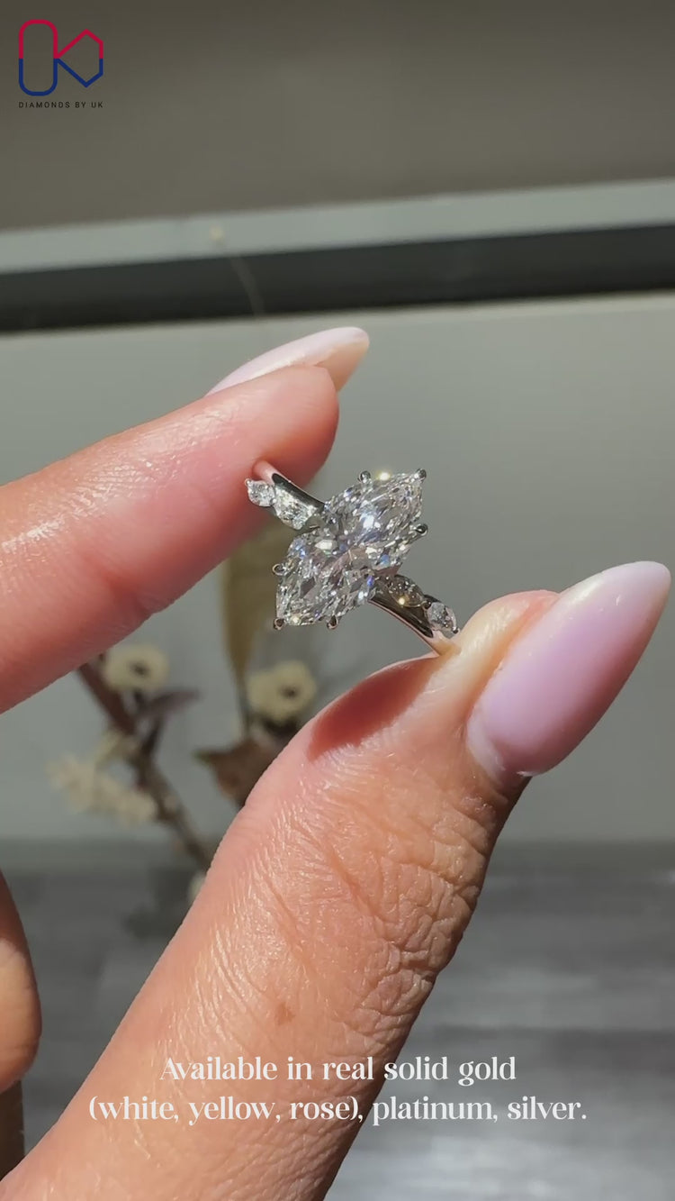 Diamondsbyuk white gold marquise diamond engagement ring.
