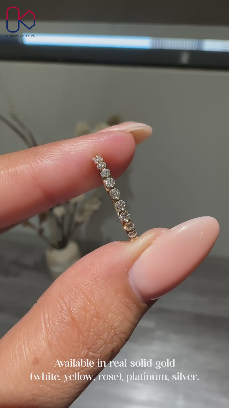 Half eternity wedding band with round cut diamonds.
