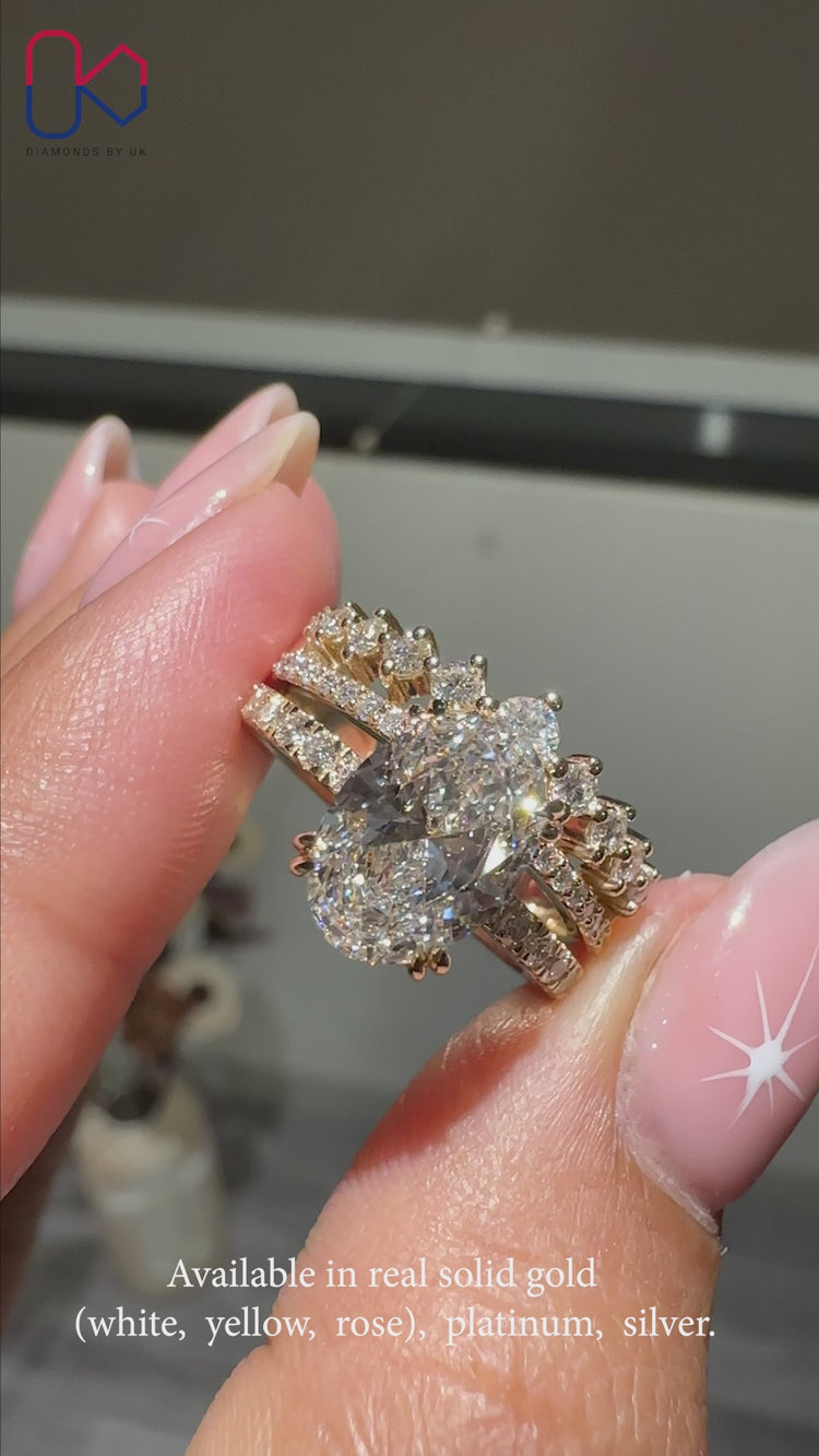 Oval diamond ring with a polished band design.
