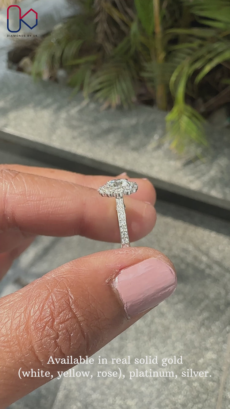 Round diamond engagement ring set in pave setting ring.

