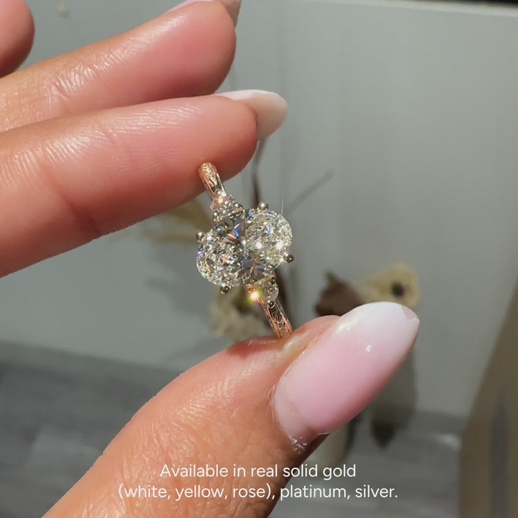 Oval engagement ring with tapered shank and four prongs
