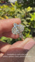 Oval and pear diamond engagement ring with a unique design.
