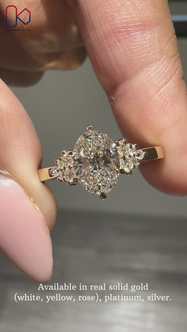 Muse setting ring with round side stones.
