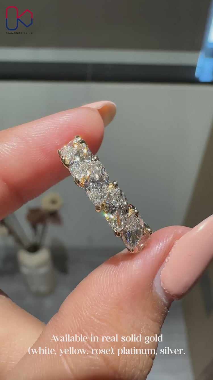 Half eternity wedding band with marquise diamonds.
