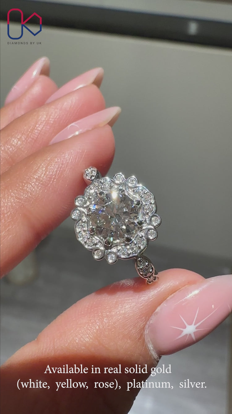 Round diamond ring with pave band in elegant style.
