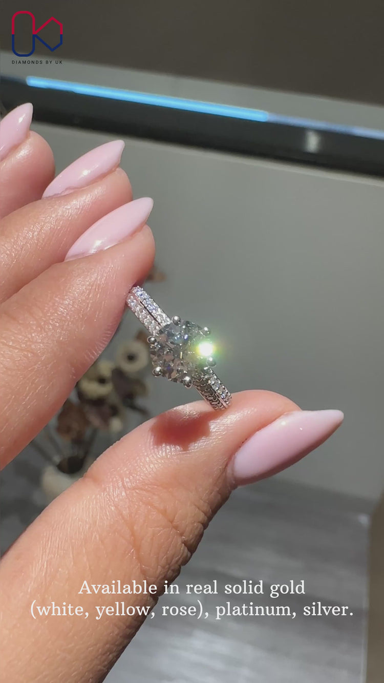 Pave setting ring featuring a dazzling round cut diamond ring design.
