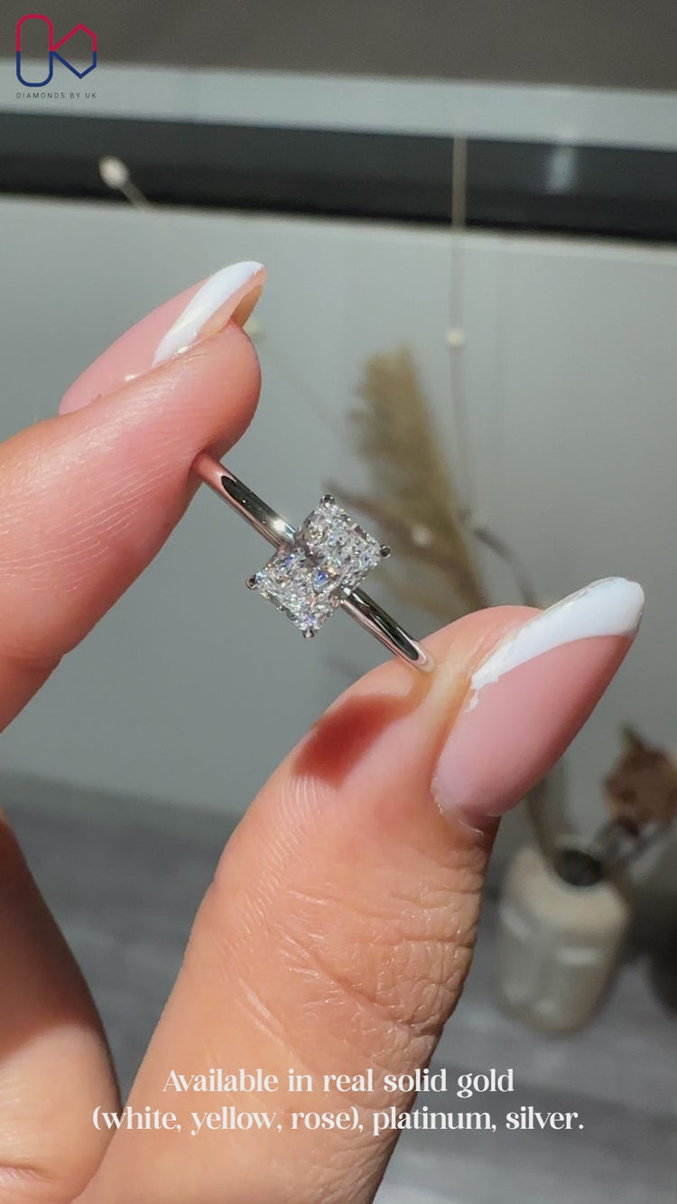 Lab grown diamond ring with radiant cut center.
