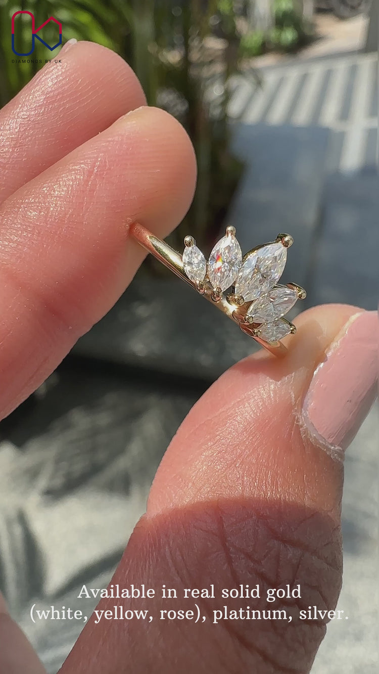 Marquise diamond wedding band featuring stunning stones and delicate craftsmanship.
