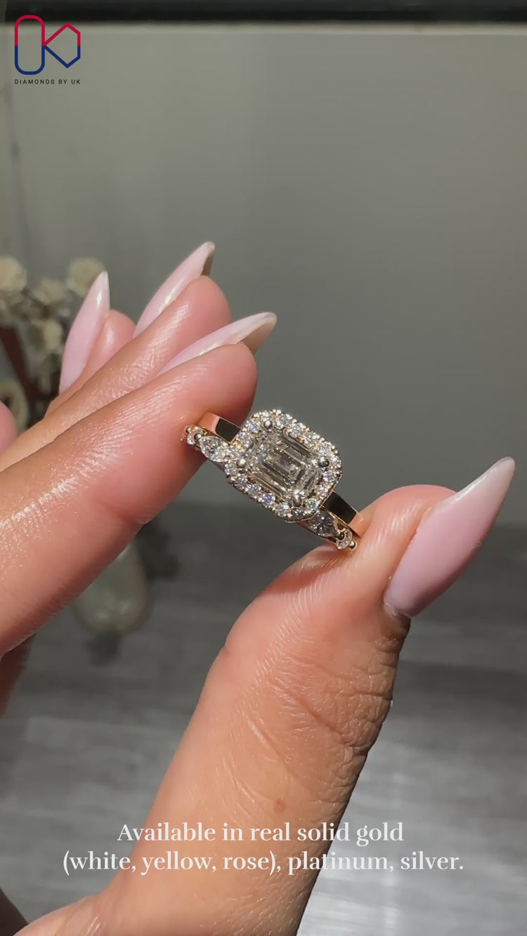 Emerald cut diamond ring with a polished band.
