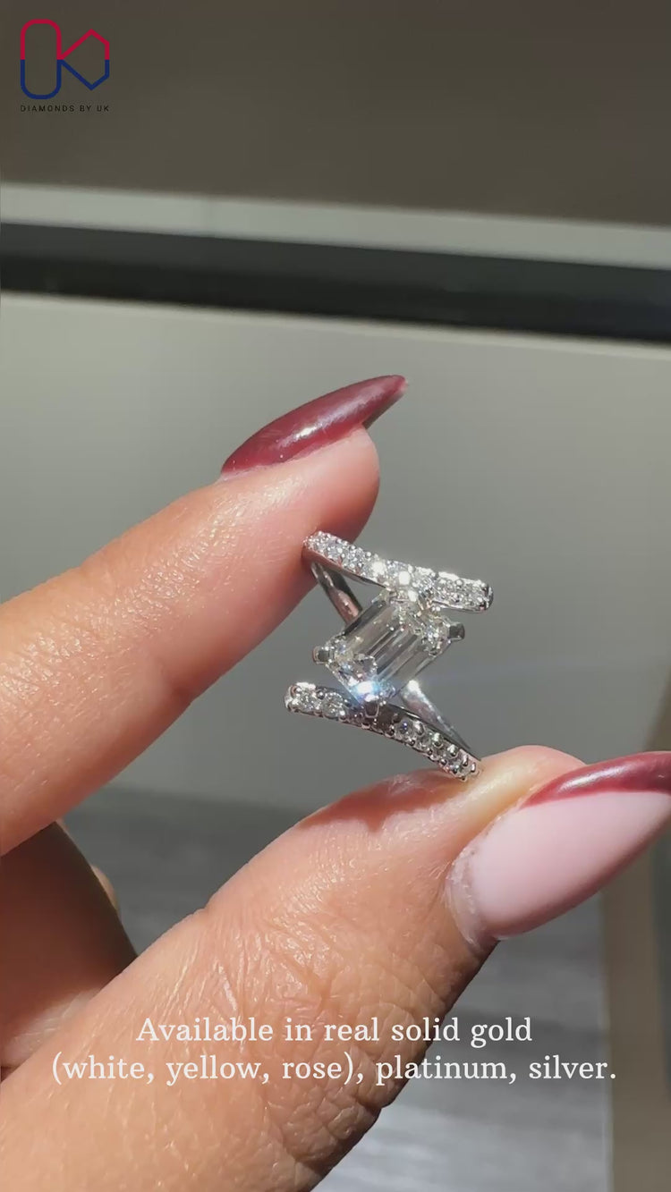 Bypass pave setting ring with round diamond accents.
