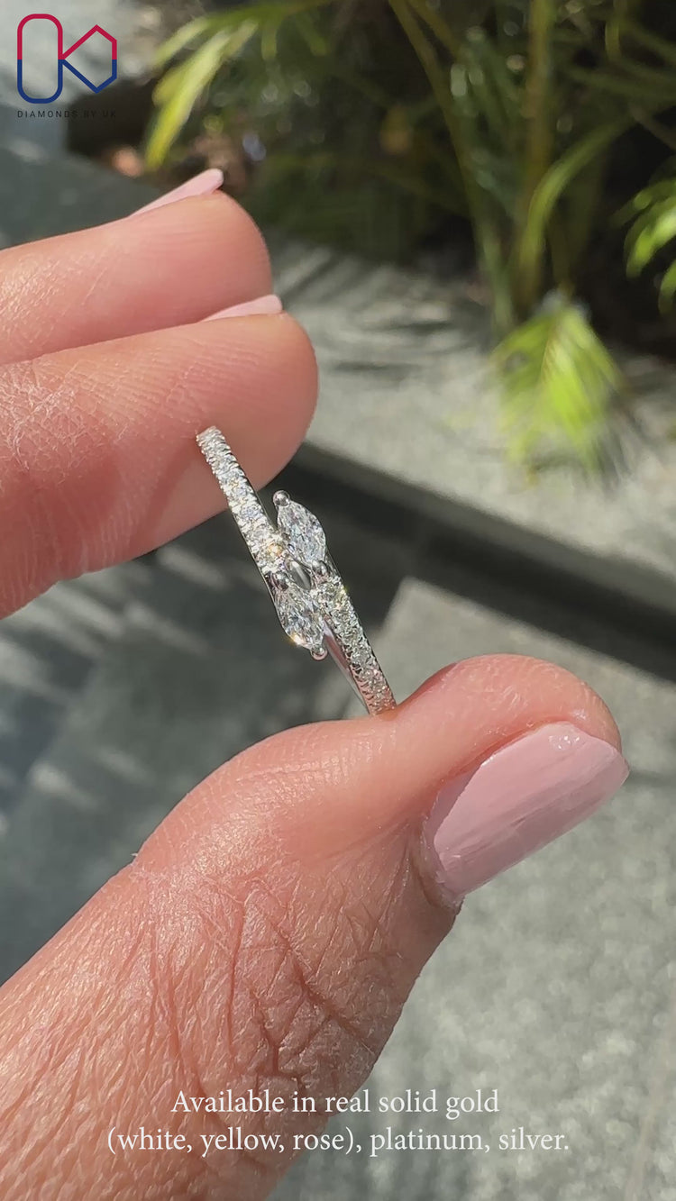 Handmade diamond band with round and marquise stones.