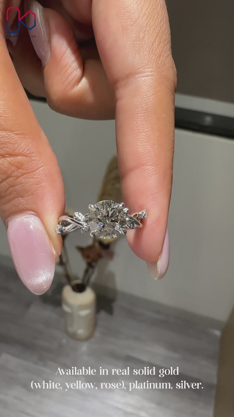 Diamondsbyuk white gold round diamond engagement ring.
