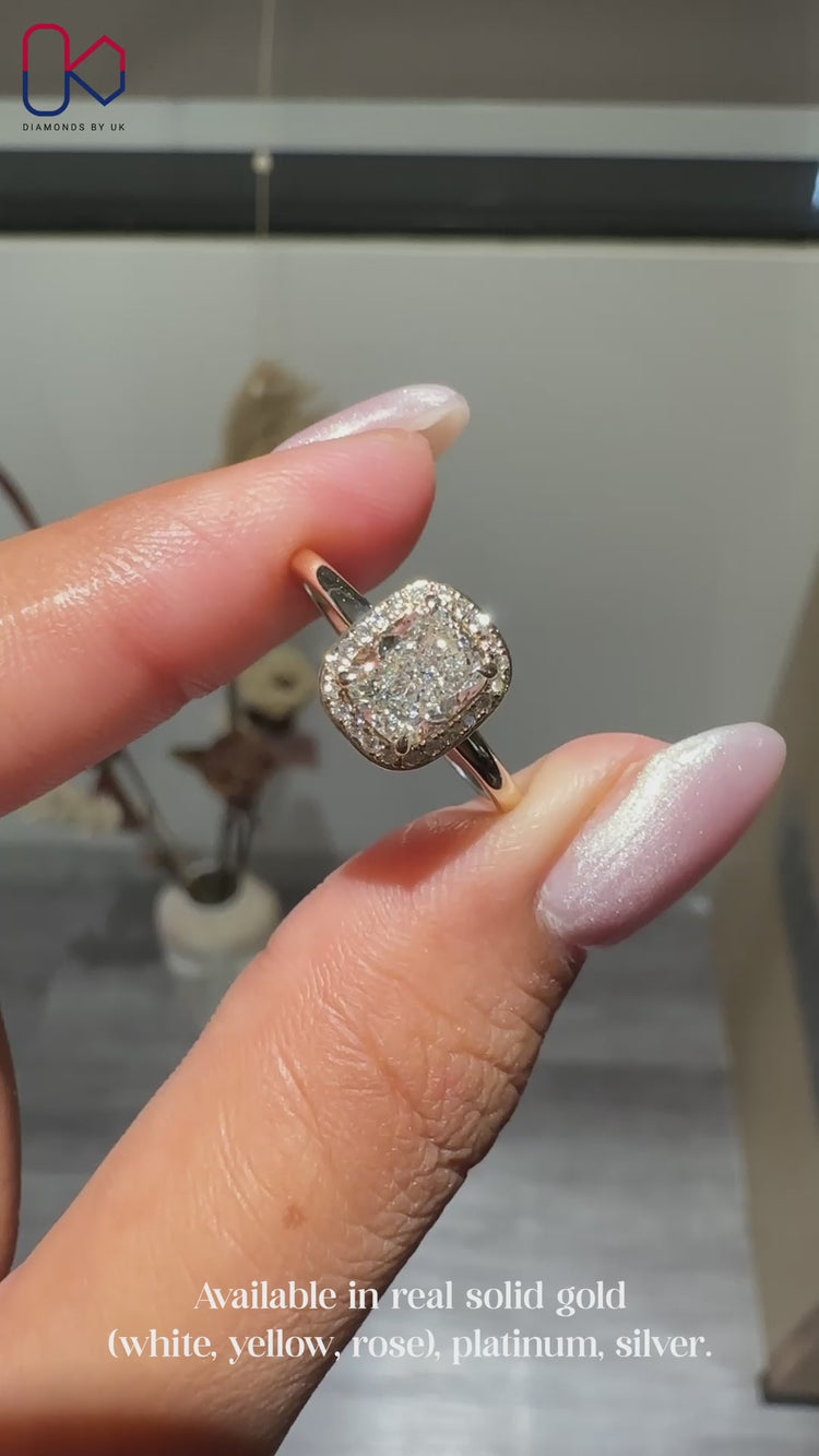 Elongated cushion cut engagement ring in yellow gold.
