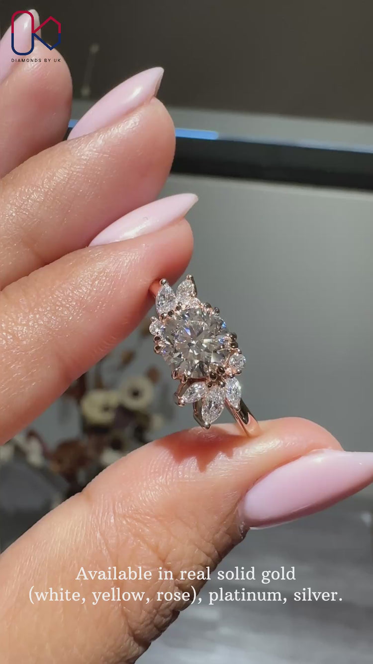 Marquise and round side stone on vintage engagement ring.
