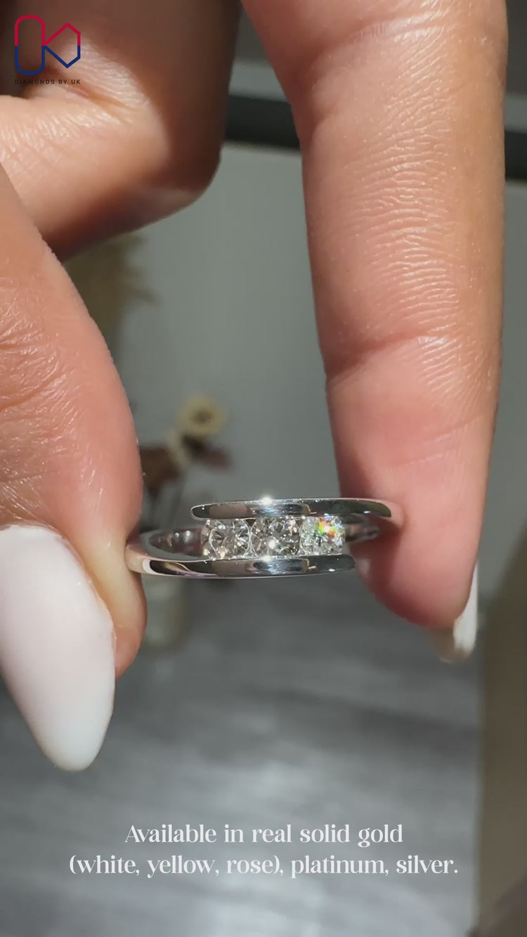 3 stone wedding band with round cut diamonds.
