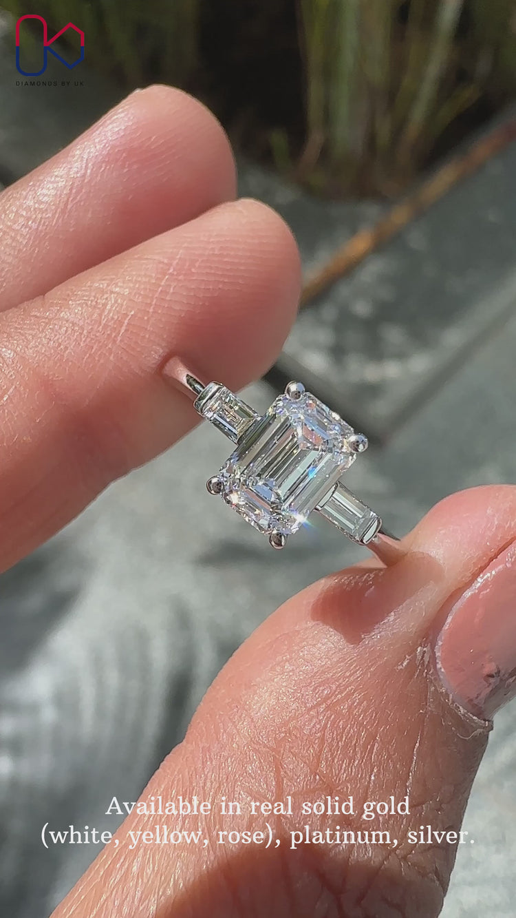 Emerald cut ring with a stunning emerald and baguette cut diamond ring.
