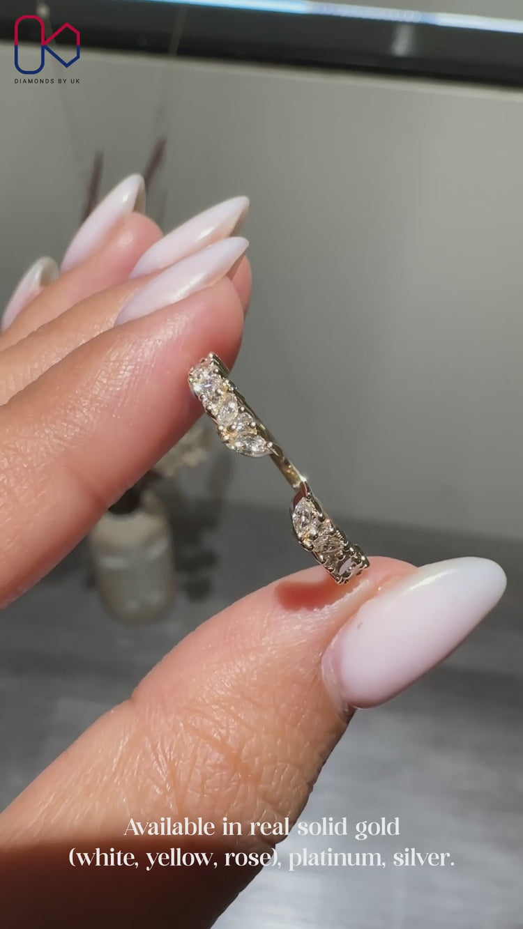 Marquise and round wedding band in yellow gold.
