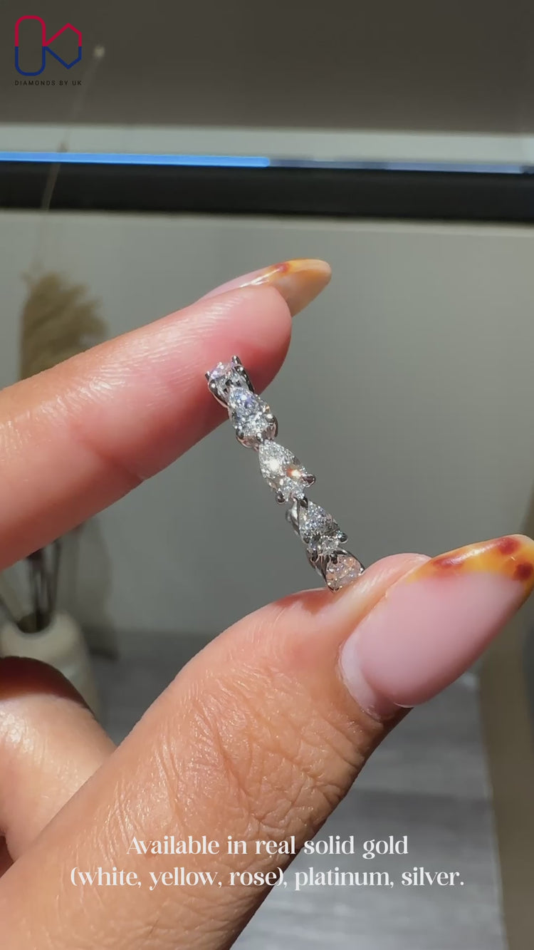 Full eternity wedding band with pear diamonds.
