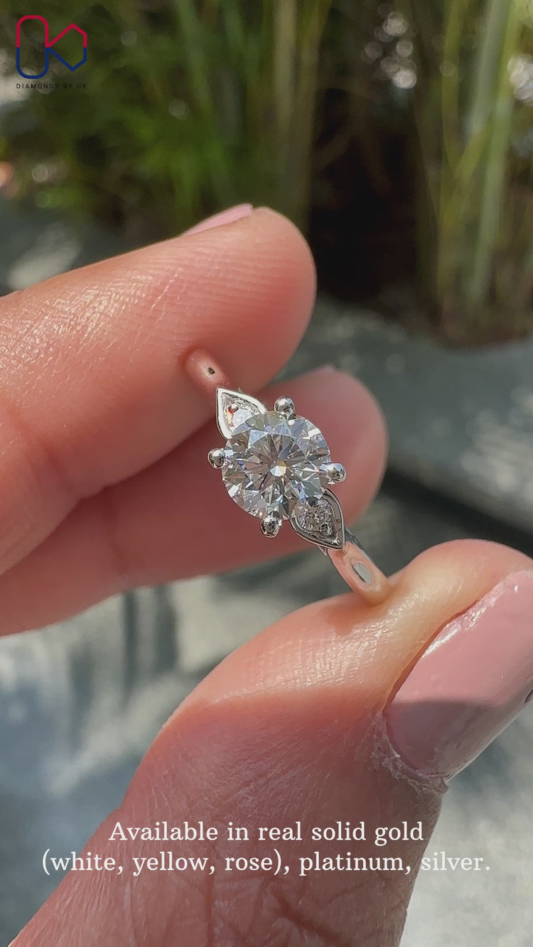 Round Diamond Ring set in a sleek white gold band.