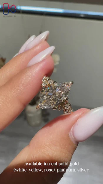 Diamondsbyuk yellow gold marquise diamond engagement ring.
