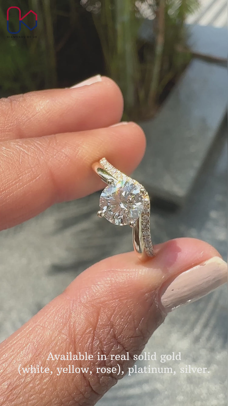 Pave setting round diamond engagement ring in yellow gold.
