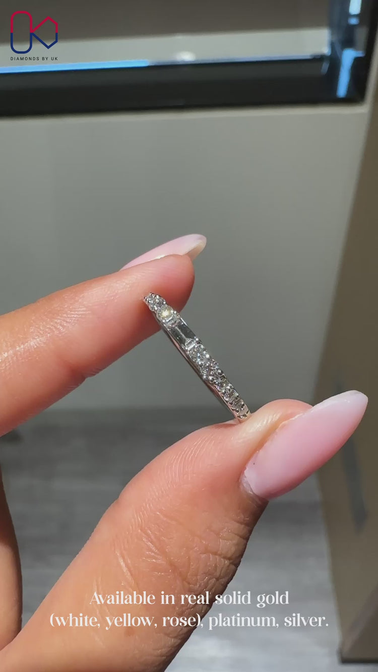 Half eternity wedding band with baguette and round diamonds.
