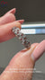 Elegant twisted diamond wedding band with brilliant round diamonds.
