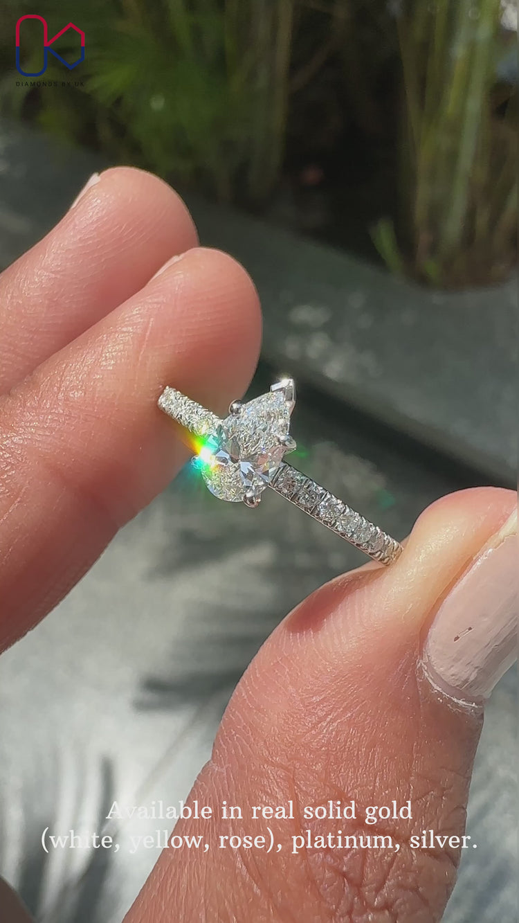 V prong setting ring featuring pear cut diamond.
