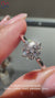 Solitaire engagement ring with bridge accent.
