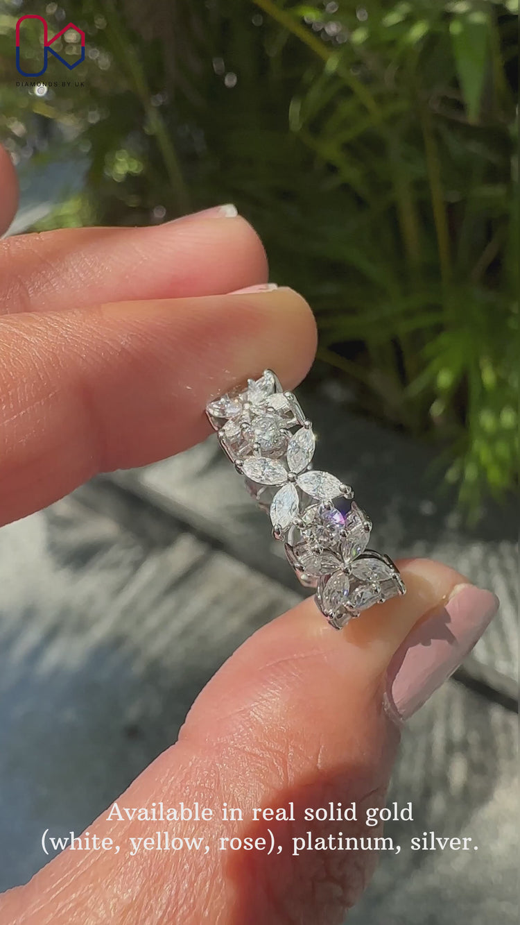 Floral eternity band with round and marquise diamonds.