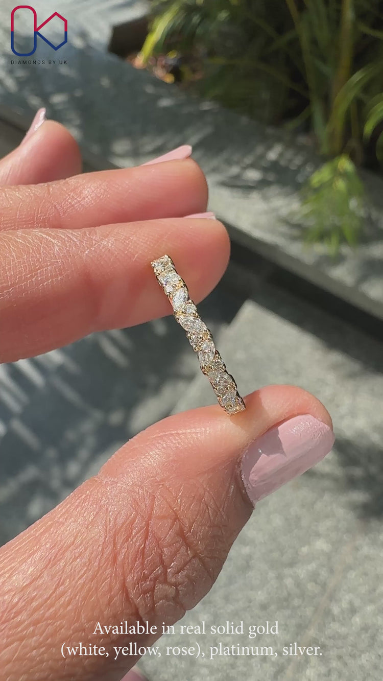 Full eternity diamond wedding band featuring alternating marquise and round lab grown stones.
