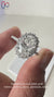 Elegant oval diamond ring with a sparkling halo.
