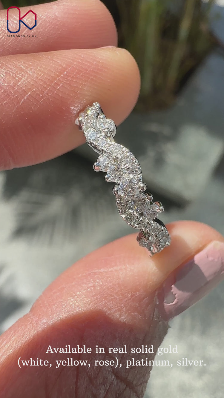 Round diamond half eternity band with twisted pavé style.