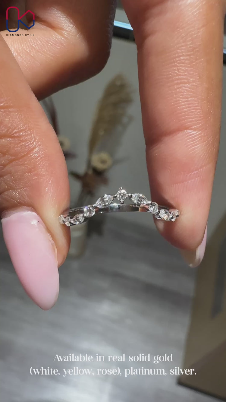 Marquise and round wedding band with chevron design.
