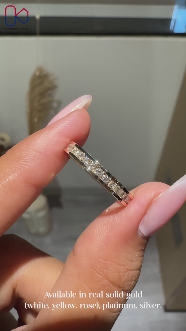 Eternity wedding band with channel set diamonds.
